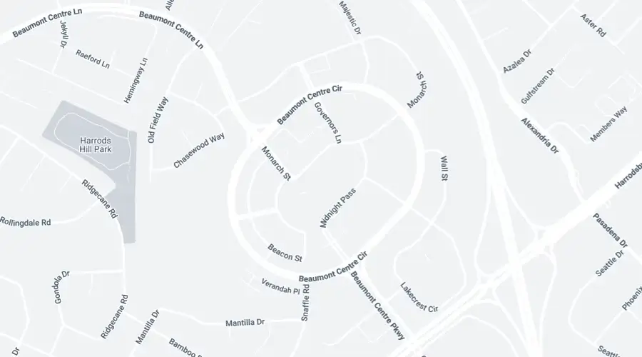 A grayscale map showing streets and labeled roads in a residential area near Harrods Hill Park, including Beaumont Centre Cir, Monarch Dr, and Chansonwood Dr.